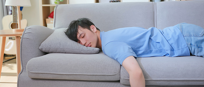 a man sleeping on the couch
